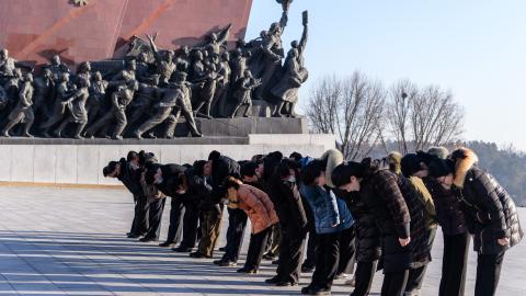 People bow as they visit the statues of late North Korean leaders Kim Il-Sung and Kim Jong-Il to pay their respects on the occasion of the 82nd birthday of late North Korean leader Kim Jong Il, known as the "Day of the Shining Star", on Mansu Hill in Pyongyang on February 16, 2024. (Photo by KIM Won Jin / AFP) (Photo by KIM WON JIN/AFP via Getty Images)